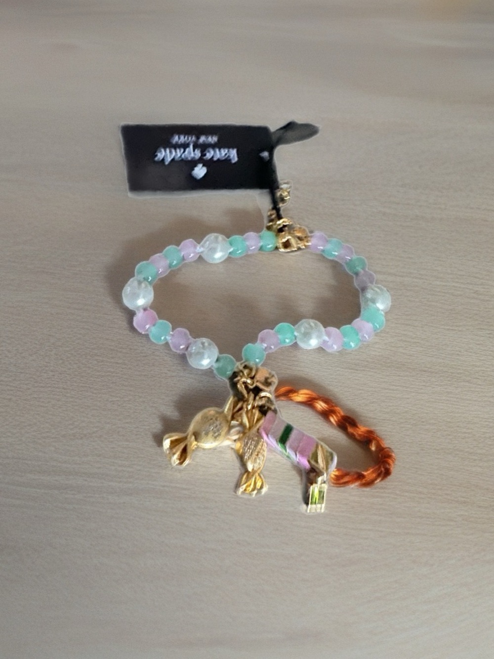 kate spade pastel beaded charm bracelet with gold-tone charms